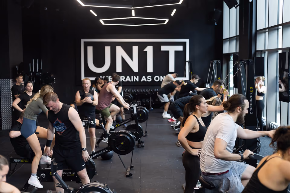 A busy MXO-led fitness session inside an equipped facility